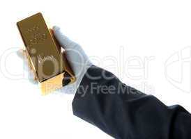 gold bar in hand of a business man