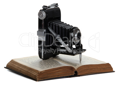 old book with historic camera