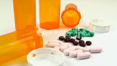 Drugs and Medicine; capsules, pills and tablets rotate clockwise