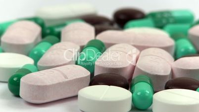 Medicine and drugs; capsules, pills, tablets rotate clockwise