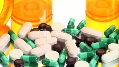 Drugs and Medicine; capsules, pills and tablets on mirror