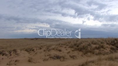 Clouds, dunes and grassland