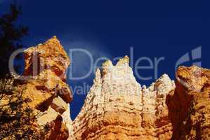 White and orange rock formations with mystic cloud, Bryce Canyon National Park, Utah