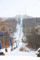 Skiers go on the lift on mountain in Primorski Territory Russia