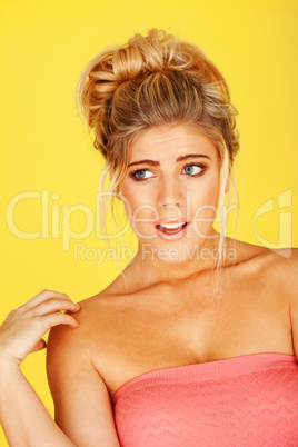 woman in a pink tube top with a shocked expression