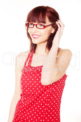 red haired woman wearing red dress with polka dots