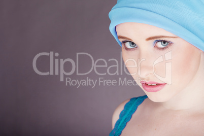 woman with blue fabric wrapped around head