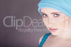 woman with blue fabric wrapped around head