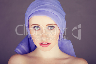 woman with blue fabric wrapped around head