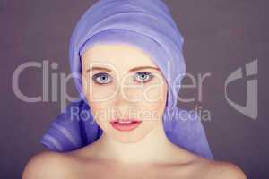 woman with blue fabric wrapped around head