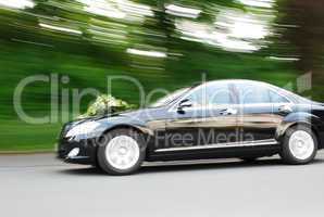 Fast Moving Wedding Car With Bouquet On Hood