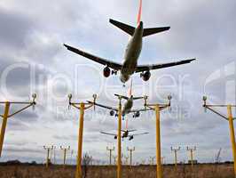 Composite of 3 airplanes landing close together