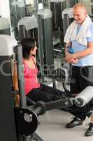 Personal trainer at fitness center show exercise