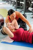Senior woman exercise abdominal in fitness center