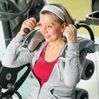 Fitness center senior woman exercise smiling