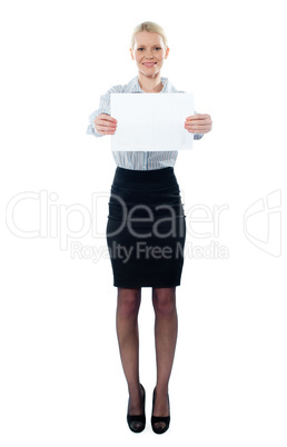 Caucasian female executive holding a blank billboard