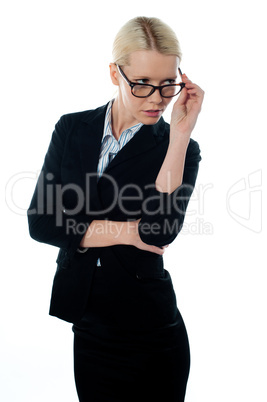 Full view of attractive businesswoman looking away