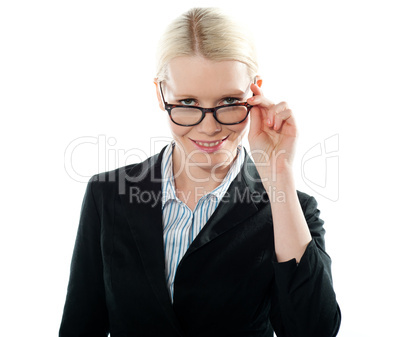 Businesswoman holding her glasses