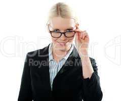 Businesswoman holding her glasses