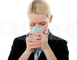 Businesswoman drinking coffee