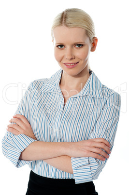Glamourous female executive posing with folded arms