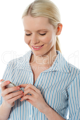 Stylish corporate female texting on phone