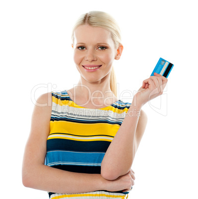 Smiling young girl holding debit-card