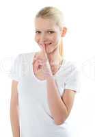 Close-up of caucasian girl gesturing silence