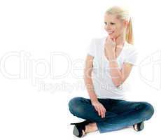 Pretty girl sitting on floor and smiling