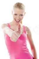 Pretty attractive girl showing thumbs-up
