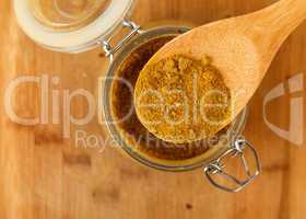 mixture spice in a wooden spoon