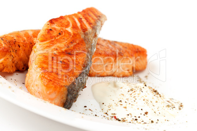 Fried salmon fillets with sauce