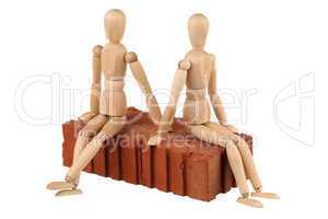 Two dummy and red brick