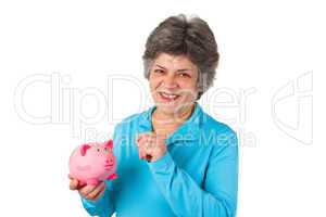 Seniorin mit Sparschwein