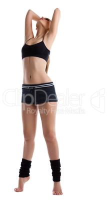 Young athletic woman posing in sport costume