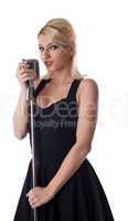 woman pin-up portrait in black with microphone