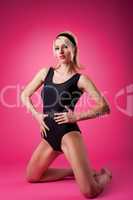 Pin-up woman sport in black swim suit