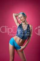 beauty blond woman stand on pink pin-up style