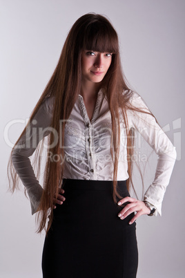 A beautiful girl with long hair coquettishly smiling