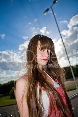 A beautiful girl with long hair looking at camera