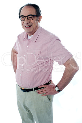 Casual man standing with hands on his waist
