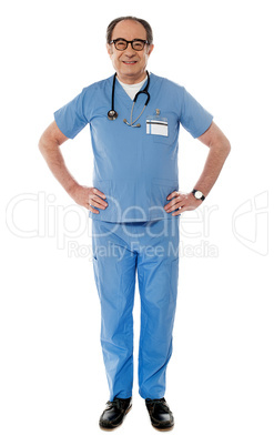 Full length view of smiling experienced medical professional