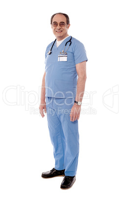 Aged doctor posing with stethoscope around his neck
