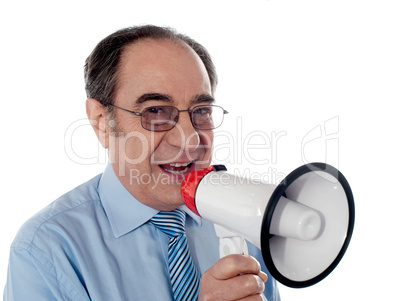 Elderly businessman making an announcement