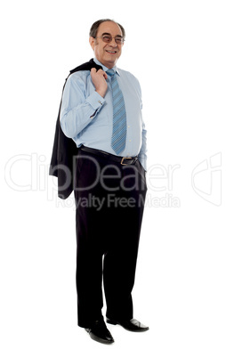 Senior businessman holding coat over his shoulders