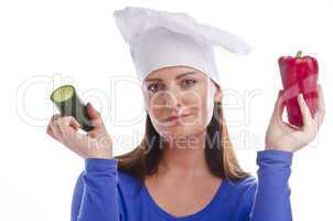 Woman with paprika and cucumber