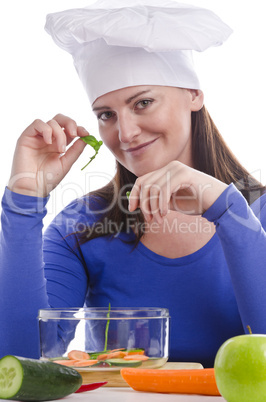 Woman with paprika and cucumber