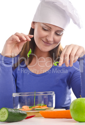 Woman with paprika and cucumber