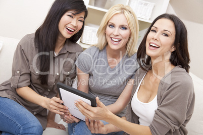 Three Women or Girl Friends Using Tablet Computer