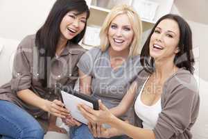 Three Women or Girl Friends Using Tablet Computer
